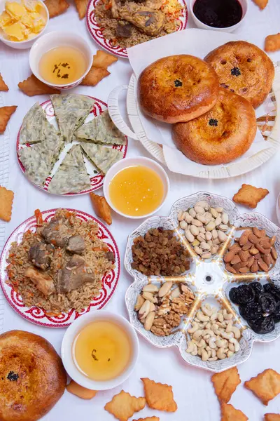 stock image Meal with traditional Kyrgyz dishes served in the yurt. Local food in Kyrgyzstan.