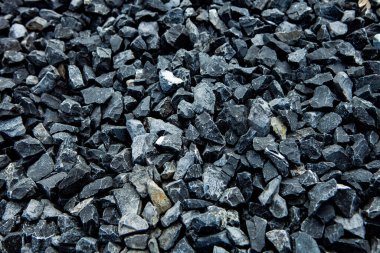 Taş duvar. Dekorasyon için taştan bir arka plan. Tasarım için doku. Granit çakıl taşı dokusu