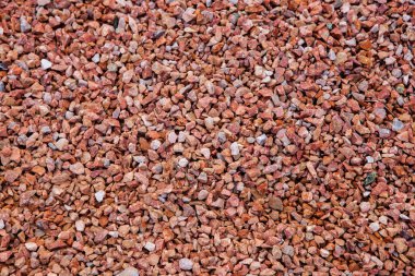 Taş duvar. Dekorasyon için taştan bir arka plan. Tasarım için doku. Granit çakıl taşı dokusu