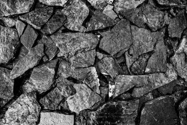 Taş duvar. Dekorasyon için taştan bir arka plan. Tasarım için doku. Granit çakıl taşı dokusu