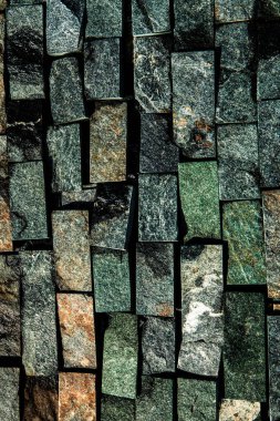 Taş duvar. Dekorasyon için taştan bir arka plan. Eski tuğla döşeme dokusu. Granit çakıl