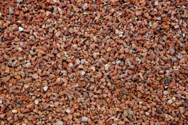 Taş duvar. Dekorasyon için taştan bir arka plan. Tasarım için doku. Granit çakıl taşı dokusu