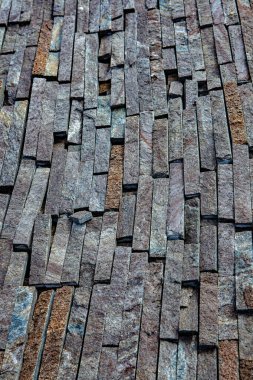 Taş duvar. Dekorasyon için taştan bir arka plan. Tasarım için doku. Granit çakıl taşı dokusu