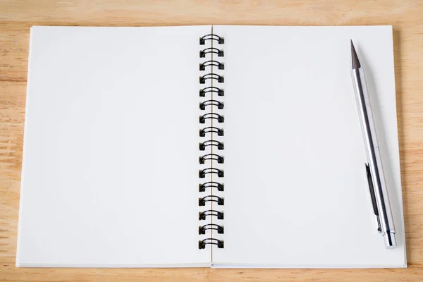 White note paper notebook with pencil on wooden table. picture used for add text or education message.