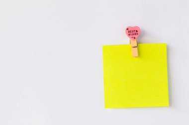 Abstract of wooden heart clip with Blank paper and stick paper on refrigerator door. paper note copy space for add text.