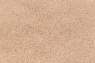 Arka plan için kahverengi kağıt dokusu. Tasarım için kusursuz bir karton kutu. Arkaplan geri dönüşüm kağıdı ürünü veya eğitim kavramı.