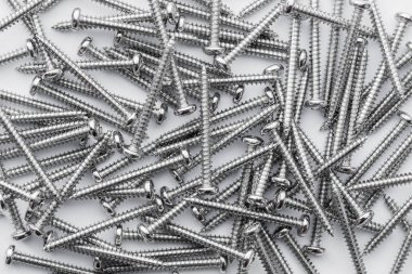 Nuts Bolts Screws nail closeup on white background