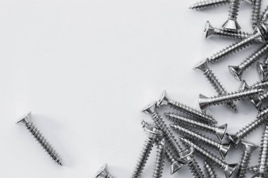 Nuts Bolts Screws nail closeup on white background