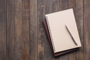 notebook with pencil on wooden table, Vintage picture tone