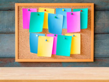 Wooden plank table for graphic stand product, interior design or montage display your product with blank paper note pin on cork board background. education concept.