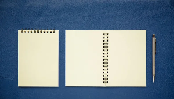 White note paper notebook with pencil on leather. picture used for add text or education message.