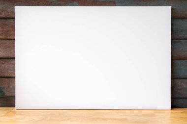 Blank white wood frame with Natural wood table texture isolated on wooden background. for add text message.