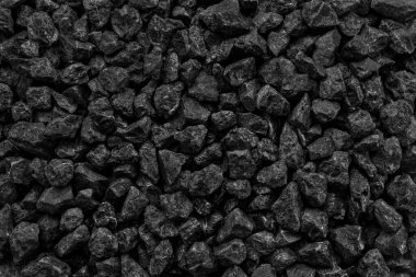 Arka plan için doğal siyah kömür. Endüstriyel kömür. Yeryüzündeki volkanik kaya enerjisi.