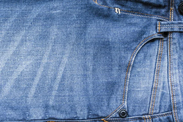 Abstract Jeans with torn marks. Retro colour tone of blue denim jeans fabric texture for background website fashion design or backdrop product.