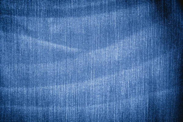 Abstract Jeans with torn marks. Retro colour tone of blue denim jeans fabric texture for background website fashion design or backdrop product.