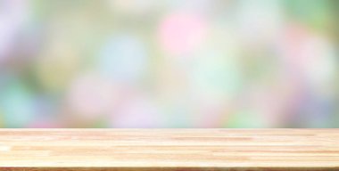 Abstract Wood table top on colorful blurred bokeh background, Picture can be used for interior design, montage or display your products.
