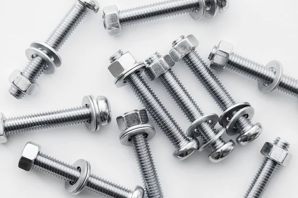 stock image Nuts and bolts closeup on white background