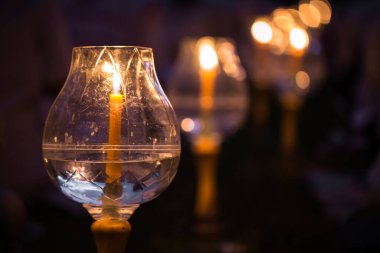 candle in glass lantern at the night. Buddha Makha Bucha Day with candle light for pray buddhists.