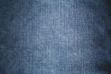 Arka plan için mavi kot kumaşı. Denim arkaplanı