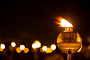 candle in glass lantern at the night. Buddha Makha Bucha Day with candle light for pray buddhists.