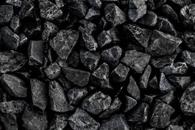 Arka plan için doğal siyah kömür. Endüstriyel kömür. Yeryüzündeki volkanik kaya enerjisi.