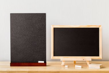 Wooden plank table for graphic stand product, interior design or montage display your product with blank texture blackboard with chalk for background. education concept.
