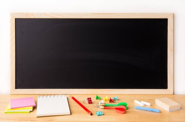 Wooden plank table for graphic stand product, interior design or montage display your product with blank texture blackboard with chalk for background. education concept.