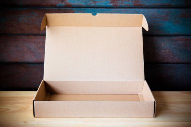 Abstract inside open cardboard packaging box for background or add text message, backdrop design product on website. Concept of shipping and delivery shopping product.