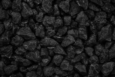 Arka plan tasarımı için doğal siyah kömür. Endüstriyel kömür. Yeryüzündeki volkanik kaya enerjisi.