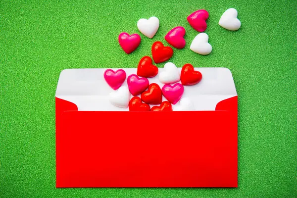 Abstract valentine \'s day, Red envelope packed with hearts on background for graphic design or add text message. Love concept.