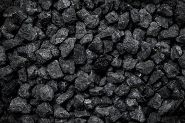 Arka plan için doğal siyah kömür. Endüstriyel kömür. Volkanik kaya tasarımı arkaplanı.