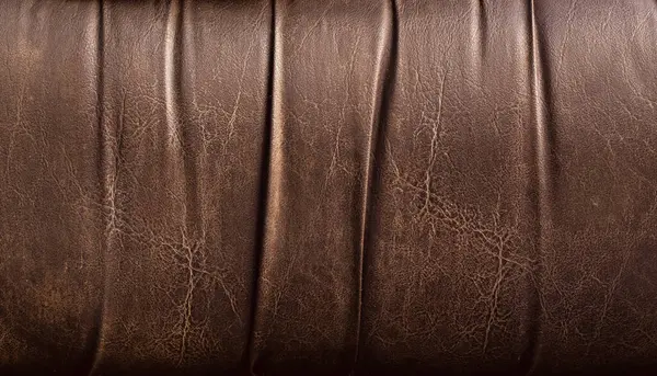 Doğal kahverengi deri dokusu. iş tasarımı ve grafik için renk ineği deri arka planı.