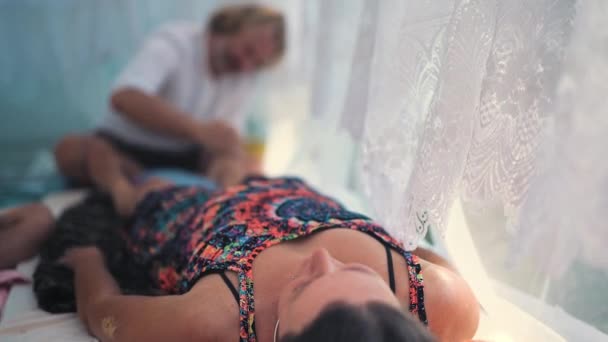 Male Masseur Massages Legs Beautiful White Ornamrental Tent — Video Stock