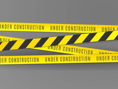 Gri bir arkaplan karşısında sarı ve siyah bantlı bir stüdyo çekimi görsel uyarı ve tehlike farkındalığı mesajı oluşturur..