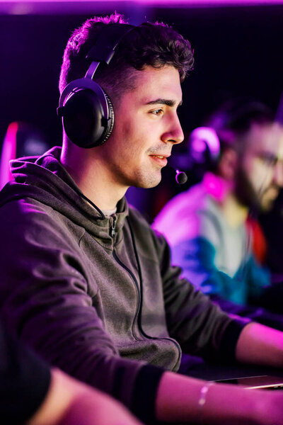 Happy gamer finishing video game in gaming room. — Stock Image Happy Gamer Finishing Video Game Gaming Room Stock Picture