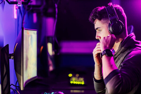 Gamer Putting Headset Head While Sitting Dark Gaming Room Royalty Free Stock Images