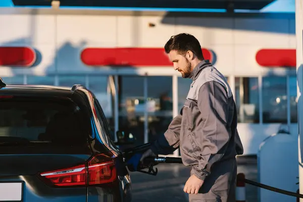 Gas Station Worker Fills Car Tank Gas Station Royalty Free Stock Images