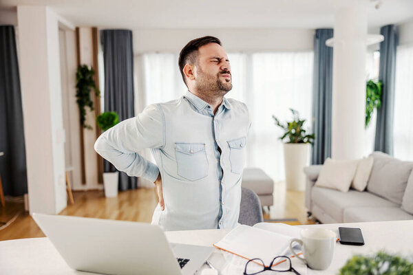 Freelancer Having Back Pain Sitting Working Home Royalty Free Stock Images