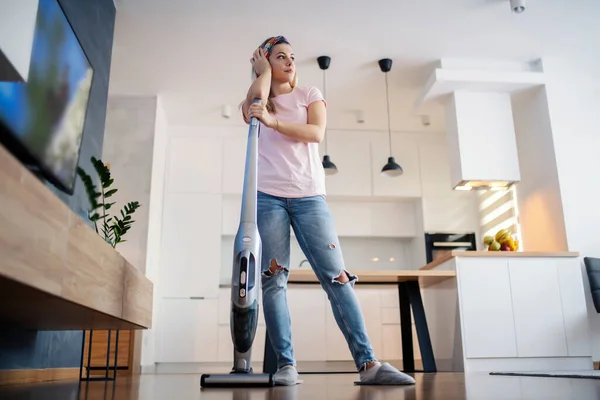 Tired Maid Leaning Vacuum Cleaner Taking Break Chores — Stock Photo, Image