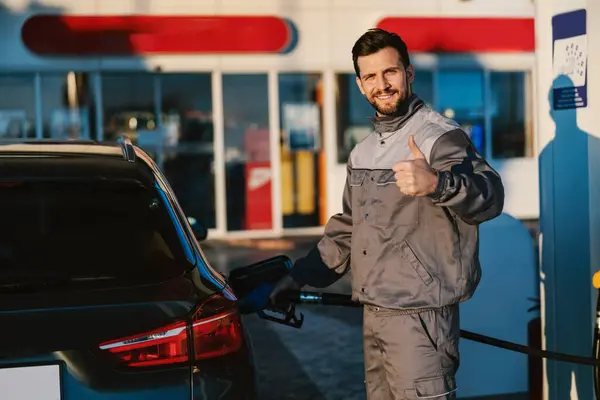 Gas Station Worker Holds Petrol Dispenser Fills Car Tank While — Stock Photo, Image