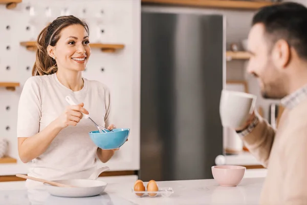 Smiling Woman Stirring Eggs Kitchen Looking Partner Morning — Stock Photo, Image