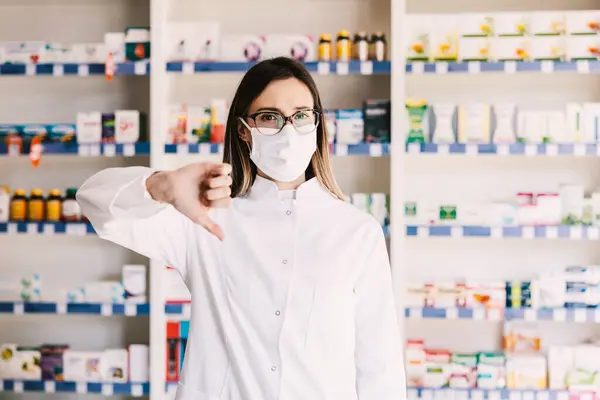 Apothecary Worker Frowning Giving Thumbs Covid Royalty Free Stock Images