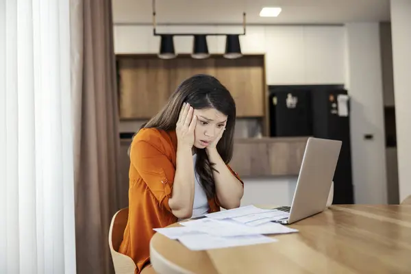Amazed Woman Looking Bills Taxes While Using Banking System Laptop Royalty Free Stock Photos