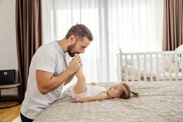 Playful Father Biting Girl Feet Plying Her Home — Stock Photo, Image