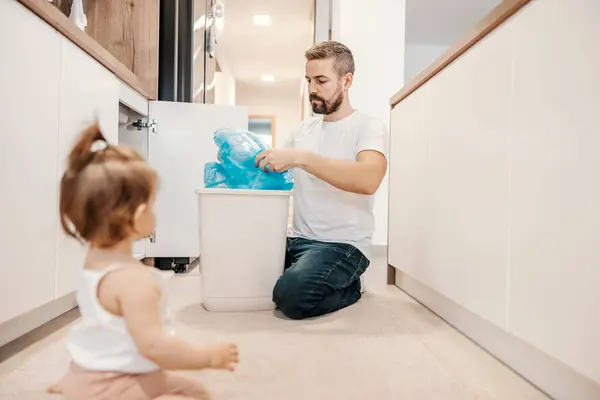 Neat Father Putting Trash Bag Can While Babysitting His Daughter — Stock Photo, Image