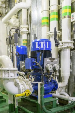 Water pump on ship. Engine room interior on big vessel.