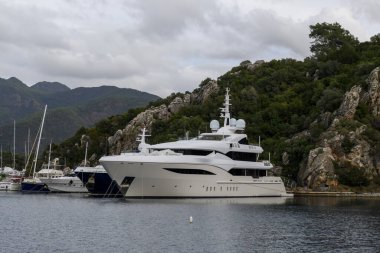 Luxury super yacht moored alongside in marina. Motor yacht. Large mega yacht. Yachting concept.