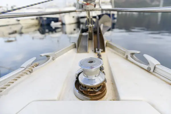 Yacht anchor gear on sailing boat. Capstan with anchor chain. Anchoring. Yachting concept.