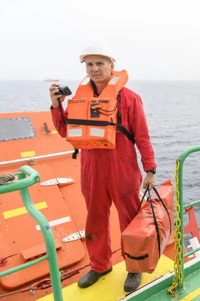 Seaman Wearing Lifejacket Vhf Radio Muster Station Abandon Ship Drill Royalty Free Stock Images