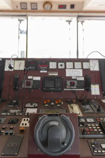 Ship\'s control device. Engine control from navigational bridge. Focused on helm, blured background.